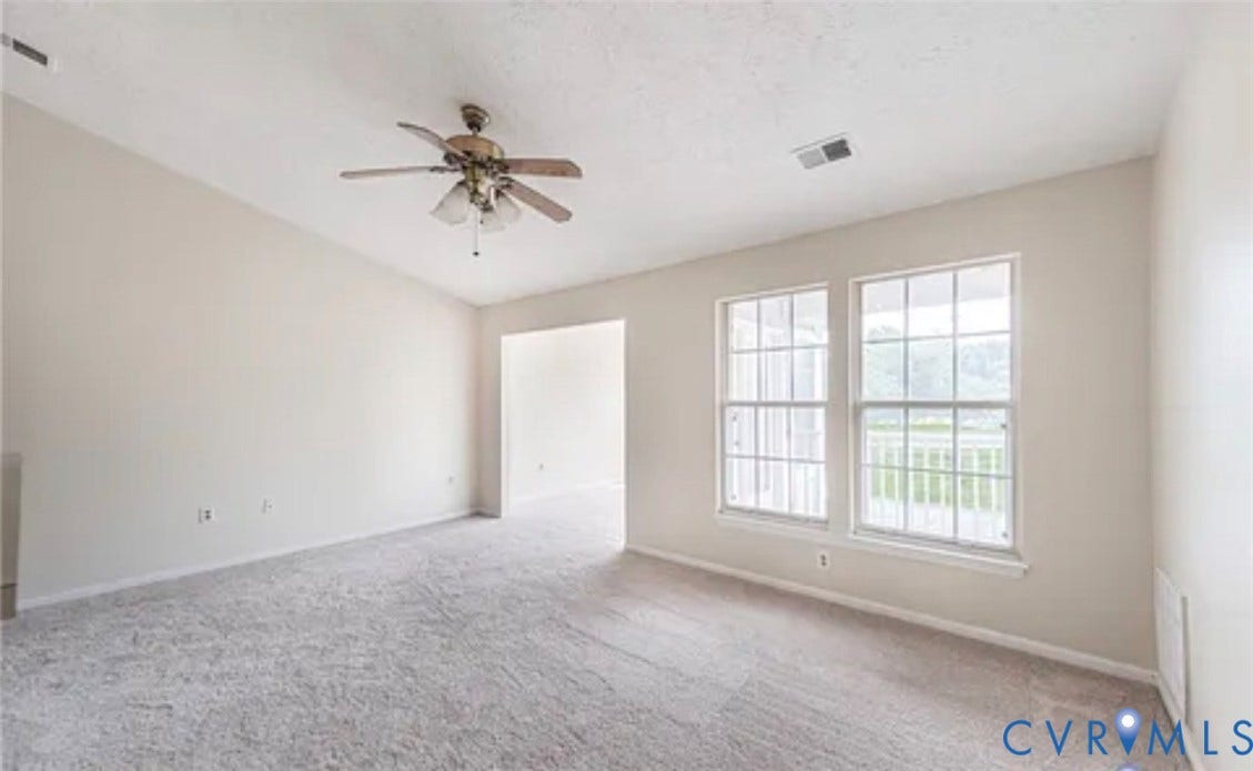 10211 Wolfe Manor Court, #711, Glen Allen, VA 23060 Interior space featuring vaulted ceilings, neutral-toned wall paint, wall-to-wall carpeting, a multi-blade ceiling fan, and double-hung windows