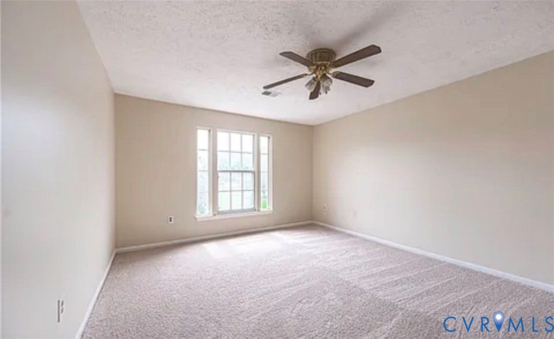 10211 Wolfe Manor Court, #711, Glen Allen, VA 23060 Neutral-toned room featuring wall-to-wall carpeting, a multi-pane window, and a ceiling-mounted fan with integrated lighting