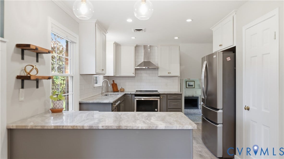 10010 Cheyenne Court, Richmond, VA 23235 Kitchen featuring light stone-patterned countertops, white shaker-style upper cabinetry, subway tile backsplash, stainless steel appliances, and dual pendant lighting