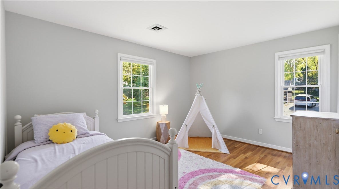 10010 Cheyenne Court, Richmond, VA 23235 Neutral-toned walls, wood-finish flooring, and multiple double-hung windows