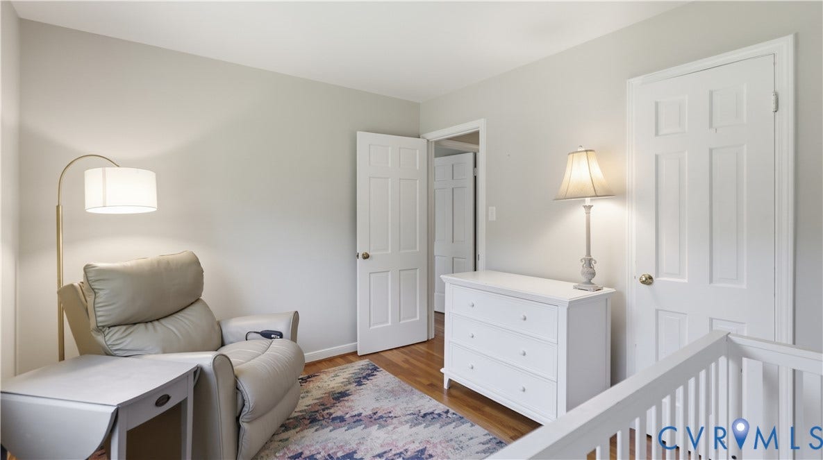 10010 Cheyenne Court, Richmond, VA 23235 Neutral wall color, wood-finish flooring, and white six-panel interior doors