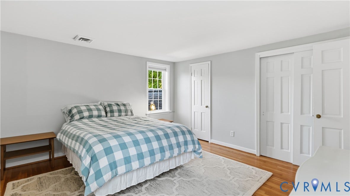 10010 Cheyenne Court, Richmond, VA 23235 Room featuring neutral wall paint, wood-finish flooring, a double-panel closet, a six-panel door, and a single-hung window
