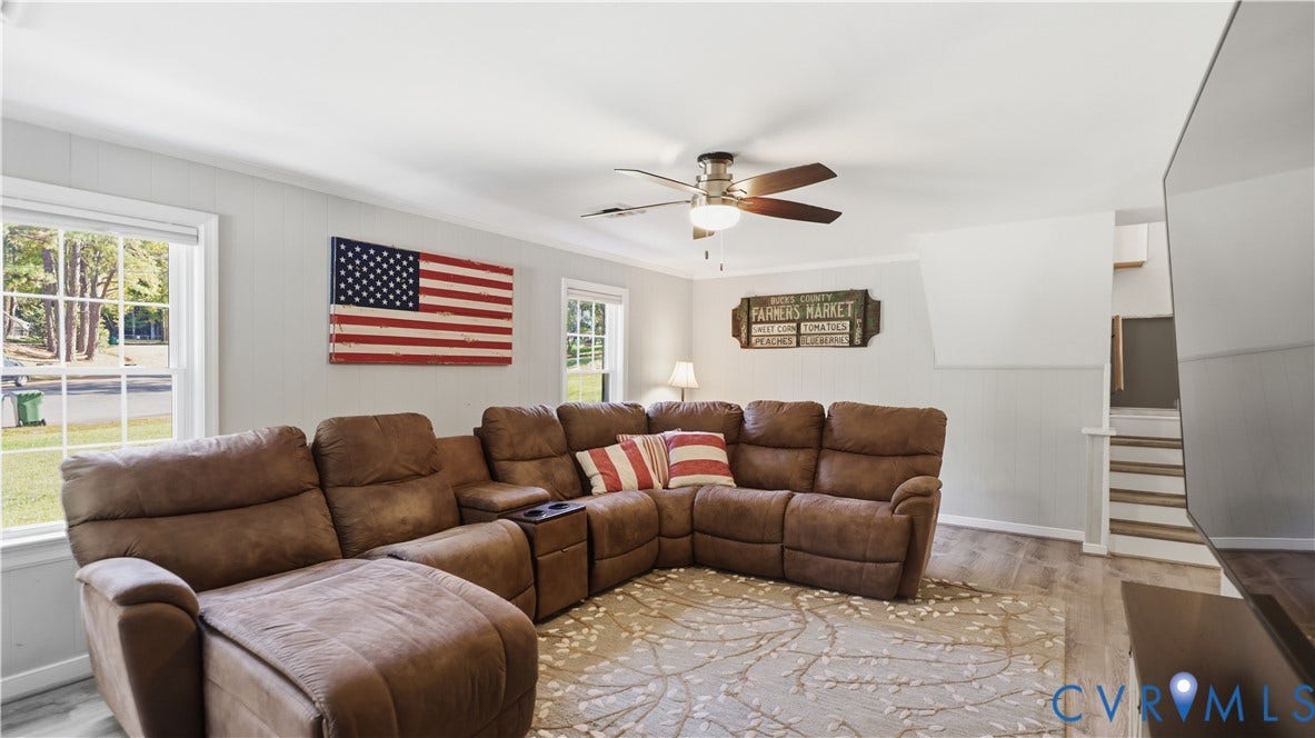 10010 Cheyenne Court, Richmond, VA 23235 Living area featuring wood-finish flooring, ceiling fan with light fixture, and multiple windows