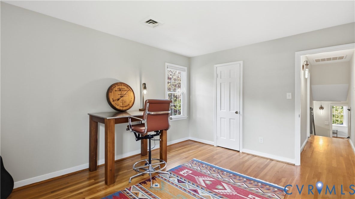 10010 Cheyenne Court, Richmond, VA 23235 Room featuring light-toned neutral walls, wood-finish flooring, a single-panel interior door, and a multi-pane window