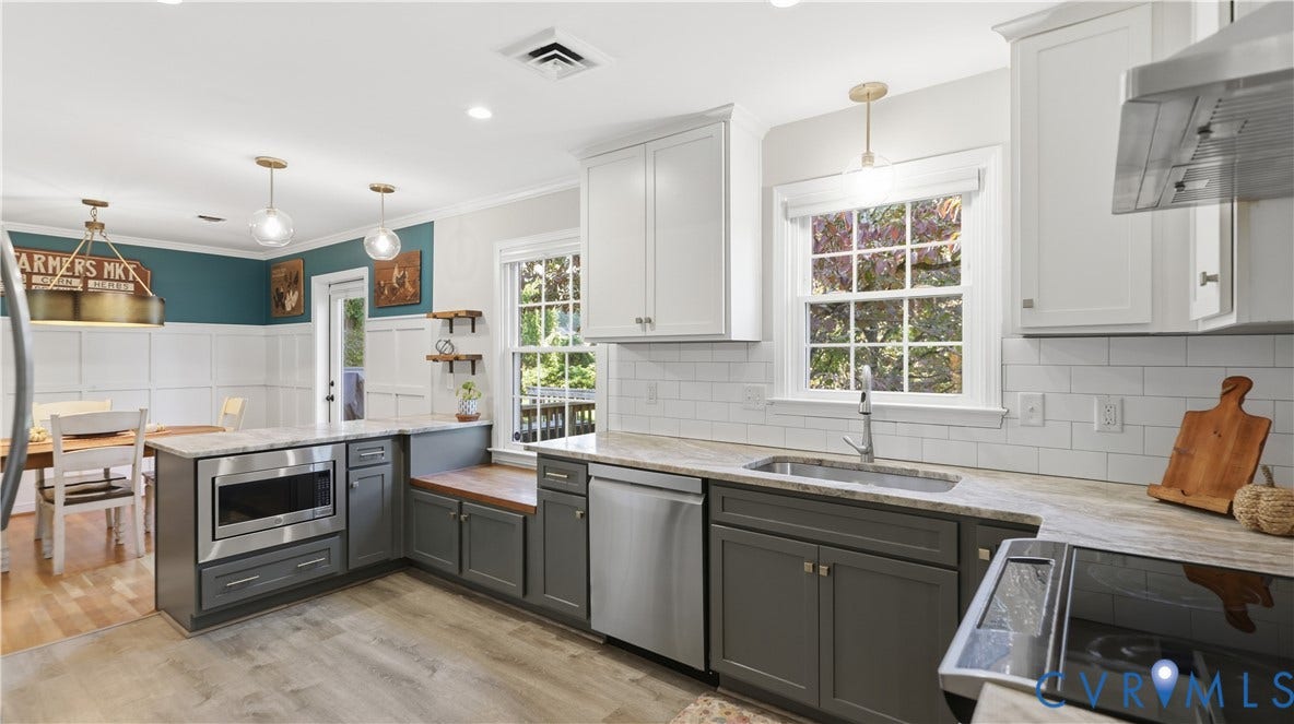 10010 Cheyenne Court, Richmond, VA 23235 Kitchen featuring two-tone cabinetry, stone-finish countertops, stainless steel appliances, a white subway tile backsplash, and wood-finish flooring