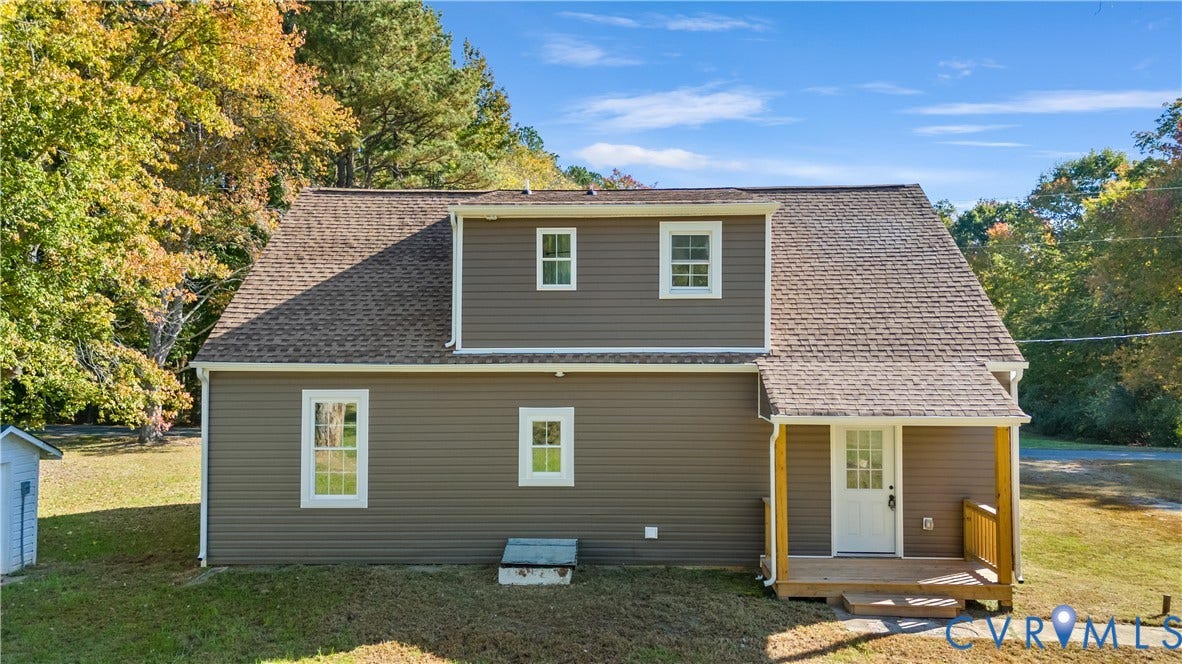 19614 Manson Church Road, Mc Kenney, VA 23872 Two-story exterior featuring brown horizontal siding, a gabled roof, multi-light door, and a front porch with wooden railings