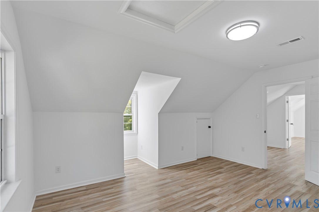 19614 Manson Church Road, Mc Kenney, VA 23872 Multi-purpose room featuring sloped ceilings, wood-finish flooring, a recessed window nook, and integrated access door for storage