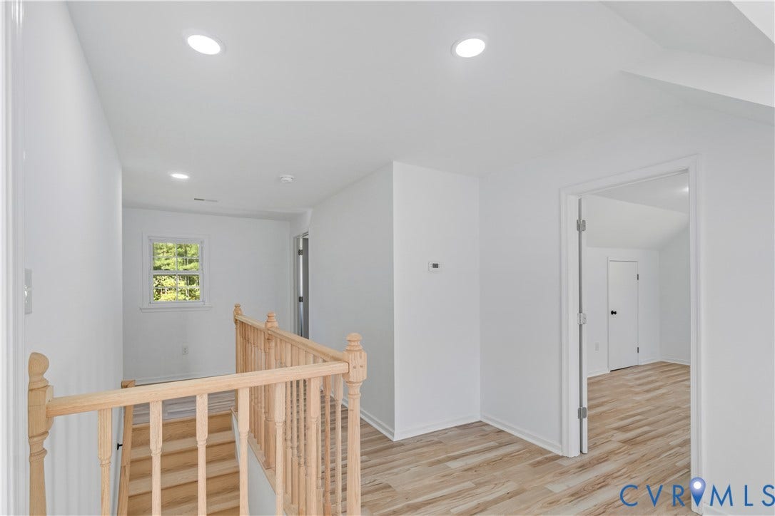 19614 Manson Church Road, Mc Kenney, VA 23872 Neutral interior space featuring wood-finish flooring, recessed lighting, and a natural wood staircase railing