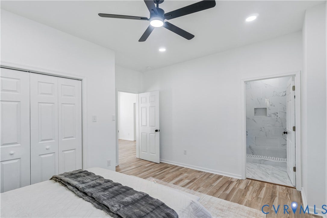 19614 Manson Church Road, Mc Kenney, VA 23872 Neutral interior featuring wood-finish flooring, a matte black ceiling fan with integrated lighting, recessed lighting, and white six-panel doors