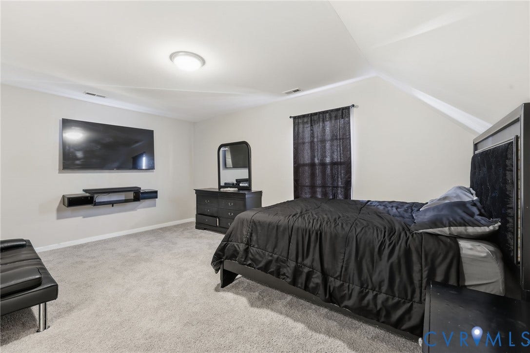 6614 Gills Gate Drive, Chesterfield, VA 23832 Neutral wall tones, wall-to-wall carpeting, and vaulted ceilings with a flush-mount light fixture