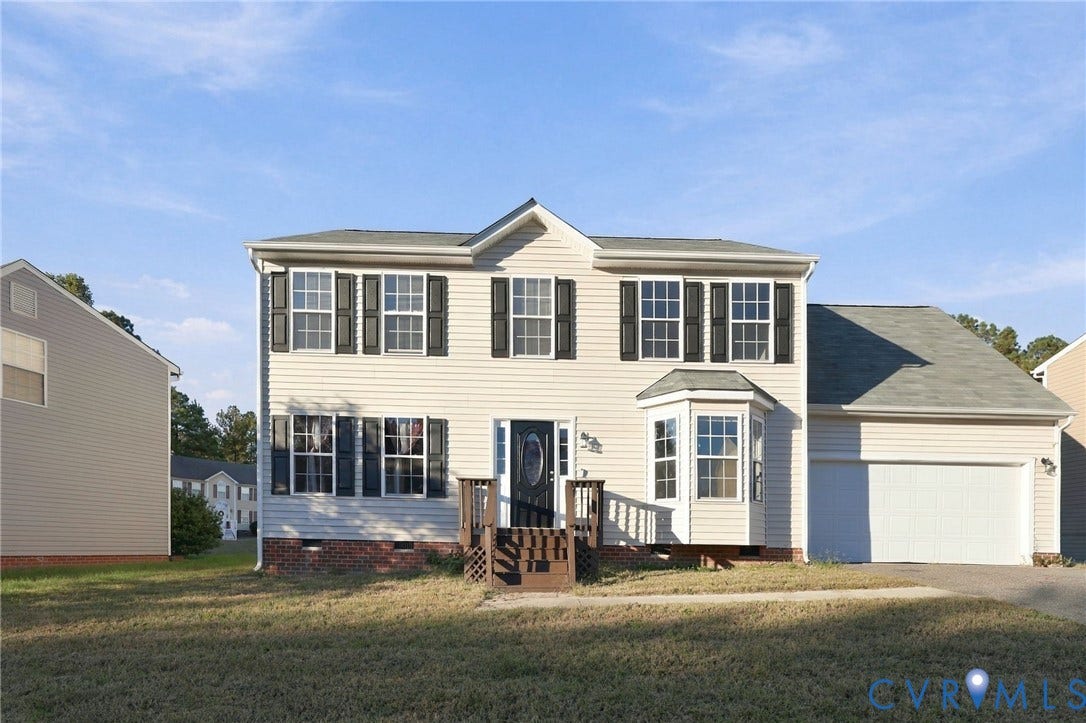 6614 Gills Gate Drive, Chesterfield, VA 23832 Two-story vinyl-sided exterior featuring dark shutters, a bay window, a brick foundation base, and an attached garage