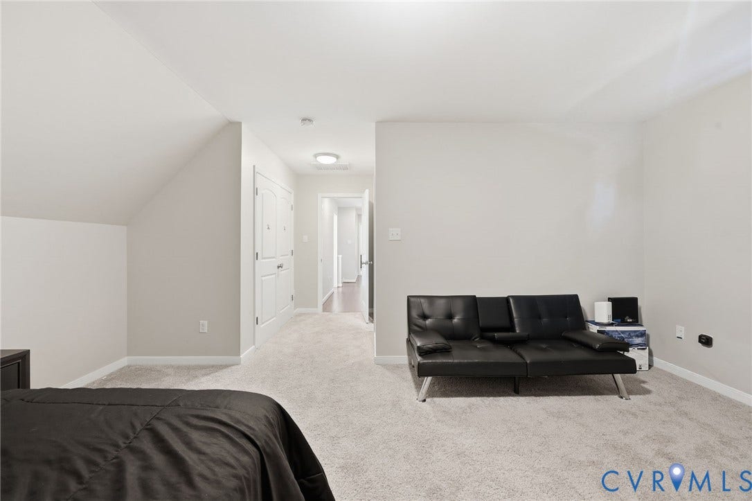 6614 Gills Gate Drive, Chesterfield, VA 23832 Neutral wall-to-wall carpeting, vaulted ceiling with architectural slope, and white-paneled interior doors