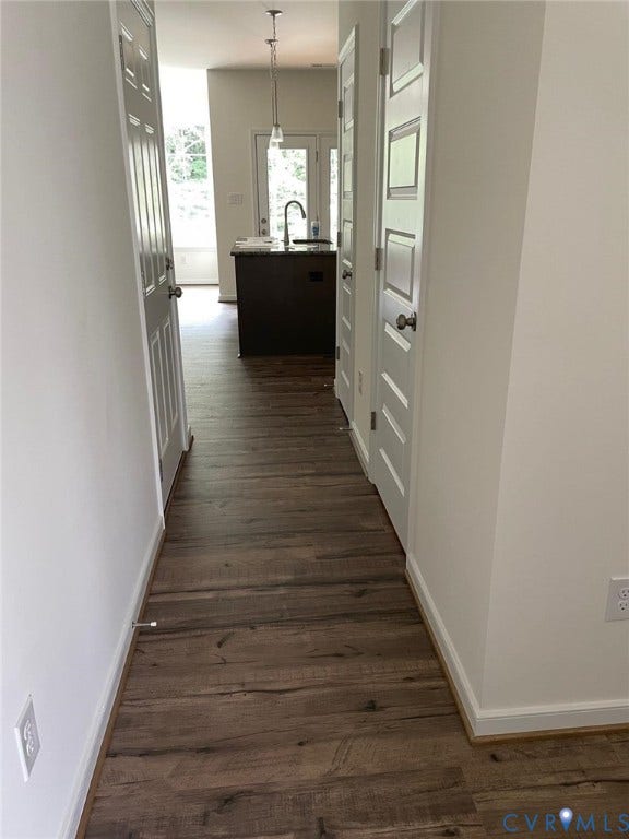 10823 Farmstead Mill Drive, Henrico, VA 23059 Corridor with sink and dark wood-type flooring
