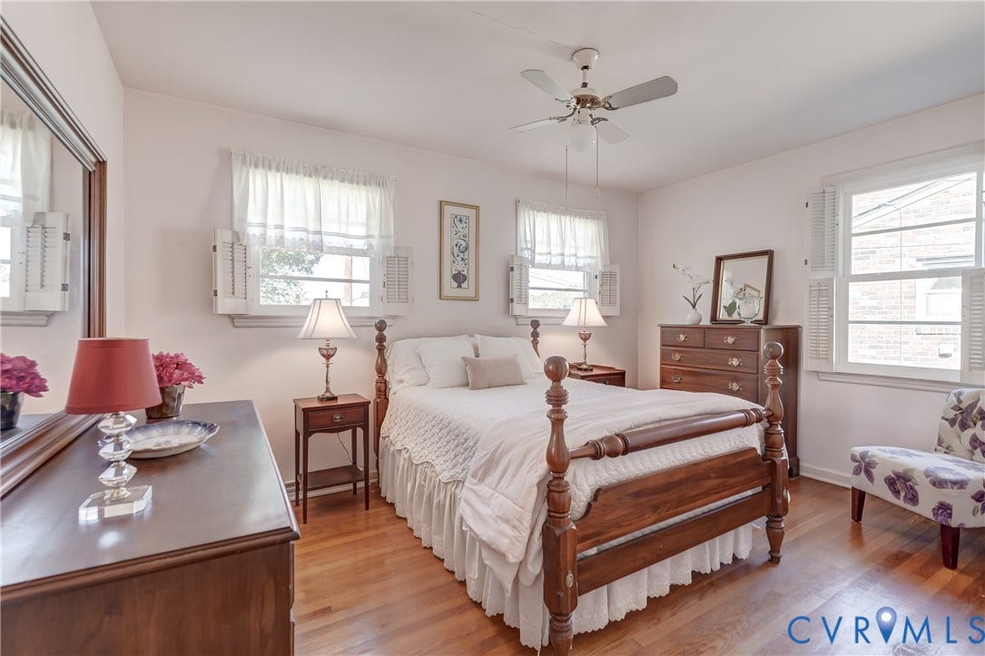409 Lilliston Avenue, Colonial Heights, VA 23834 Hardwood flooring, triple-window configuration, ceiling fan with integrated lighting, and plantation-style interior shutters