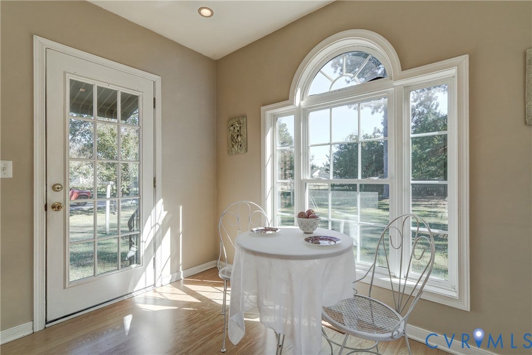 409 Lilliston Avenue, Colonial Heights, VA 23834 Wood-finish flooring, multi-light glass door, and large arched window with grid detailing