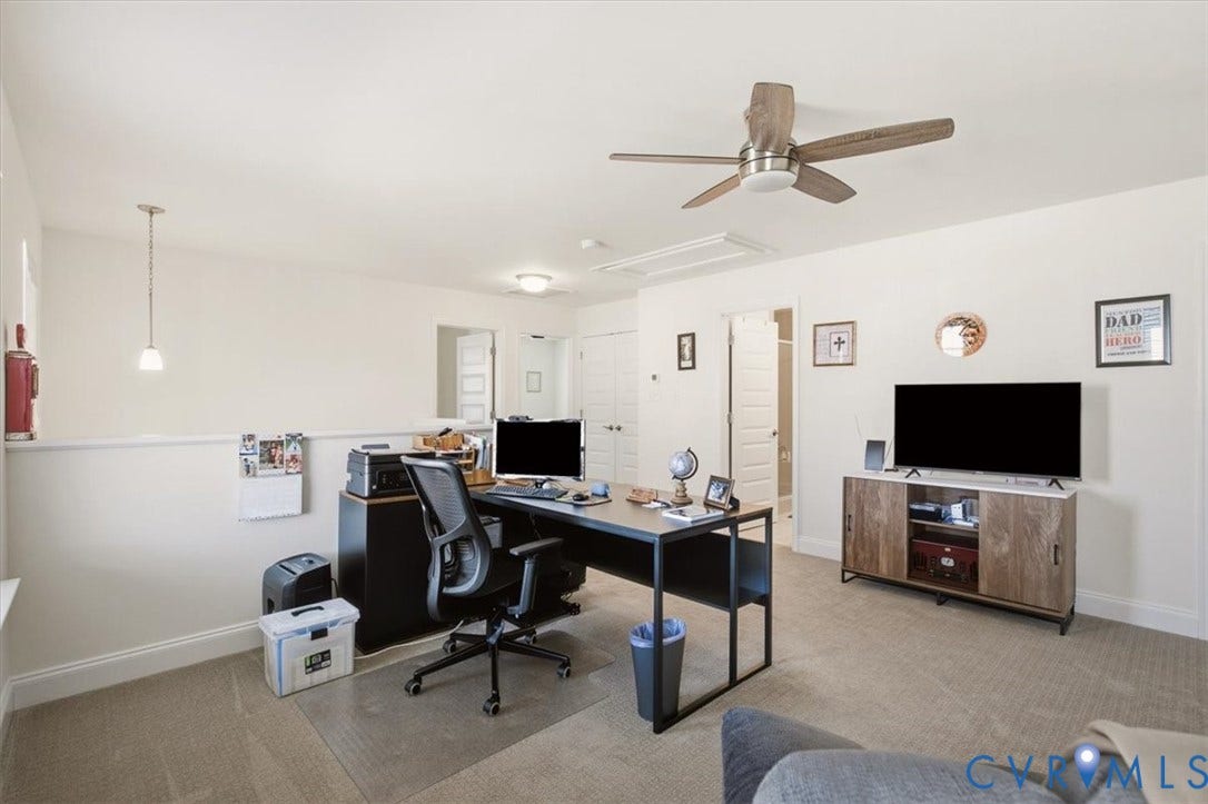18743 Palisades Ridge, Palisades Cove, Moseley, VA 23120 Multi-purpose room featuring neutral carpeting, a ceiling fan with integrated lighting, a pendant light fixture, and interior doors