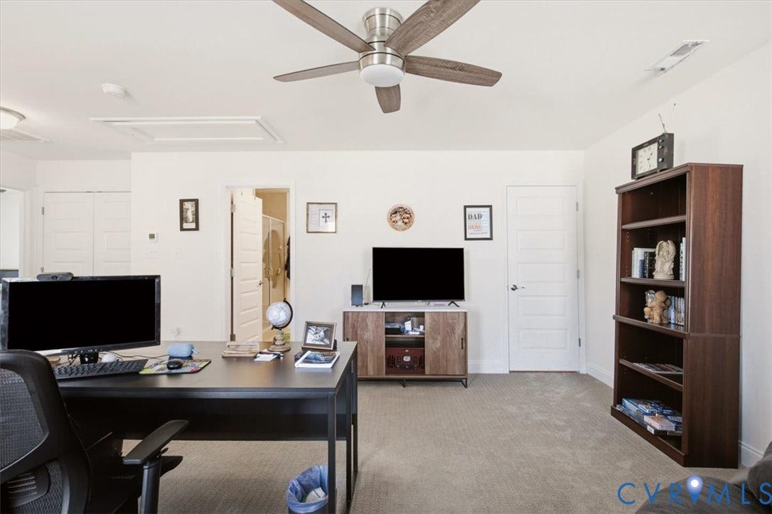 18743 Palisades Ridge, Palisades Cove, Moseley, VA 23120 Neutral interior featuring a ceiling fan with integrated lighting, carpeted flooring, and multiple interior paneled doors