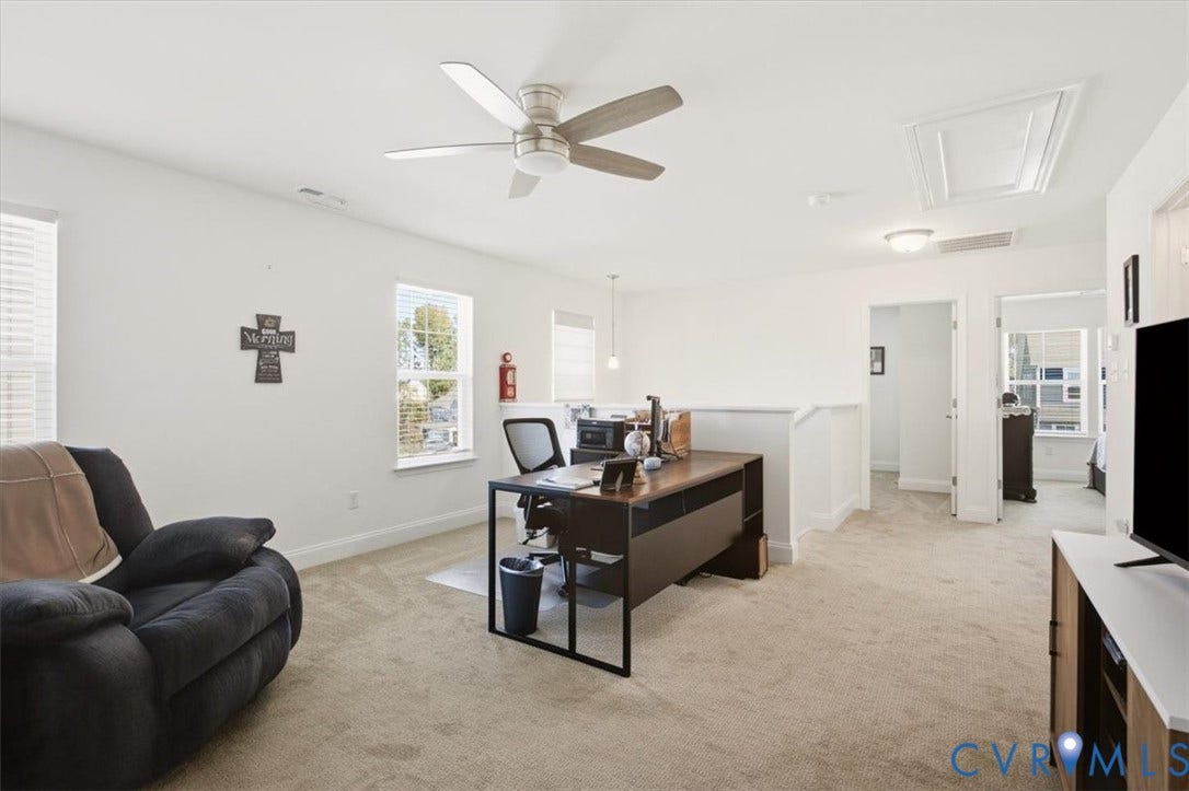 18743 Palisades Ridge, Palisades Cove, Moseley, VA 23120 Neutral-toned carpeted flooring, brushed metal ceiling fan, and multiple windows providing natural light