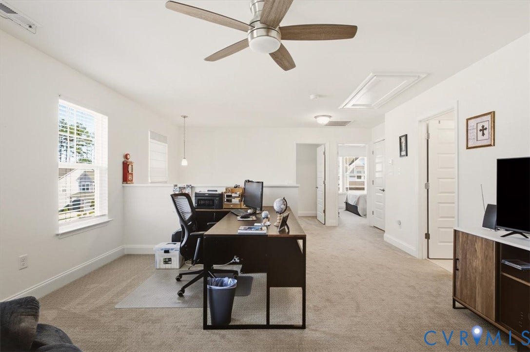 18743 Palisades Ridge, Palisades Cove, Moseley, VA 23120 Neutral-toned interior space featuring wall-to-wall carpeting, a ceiling fan with integrated lighting, dual-pane windows, and multi-panel interior doors