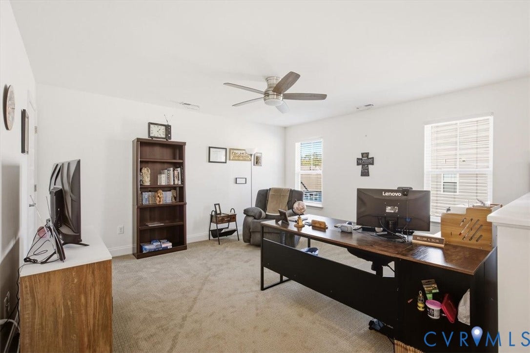 18743 Palisades Ridge, Palisades Cove, Moseley, VA 23120 Neutral-toned wall-to-wall carpeting, ceiling fan with integrated lighting, and multiple windows providing natural light