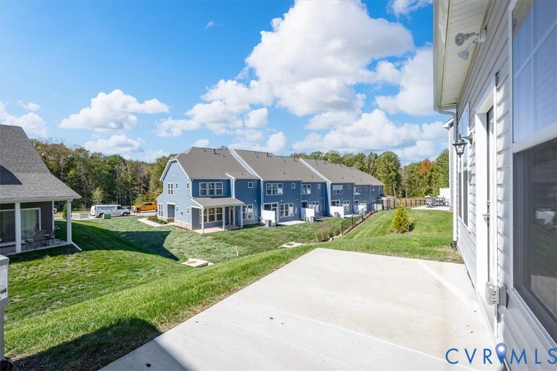 18743 Palisades Ridge, Palisades Cove, Moseley, VA 23120 Concrete patio featuring exterior light fixtures and siding