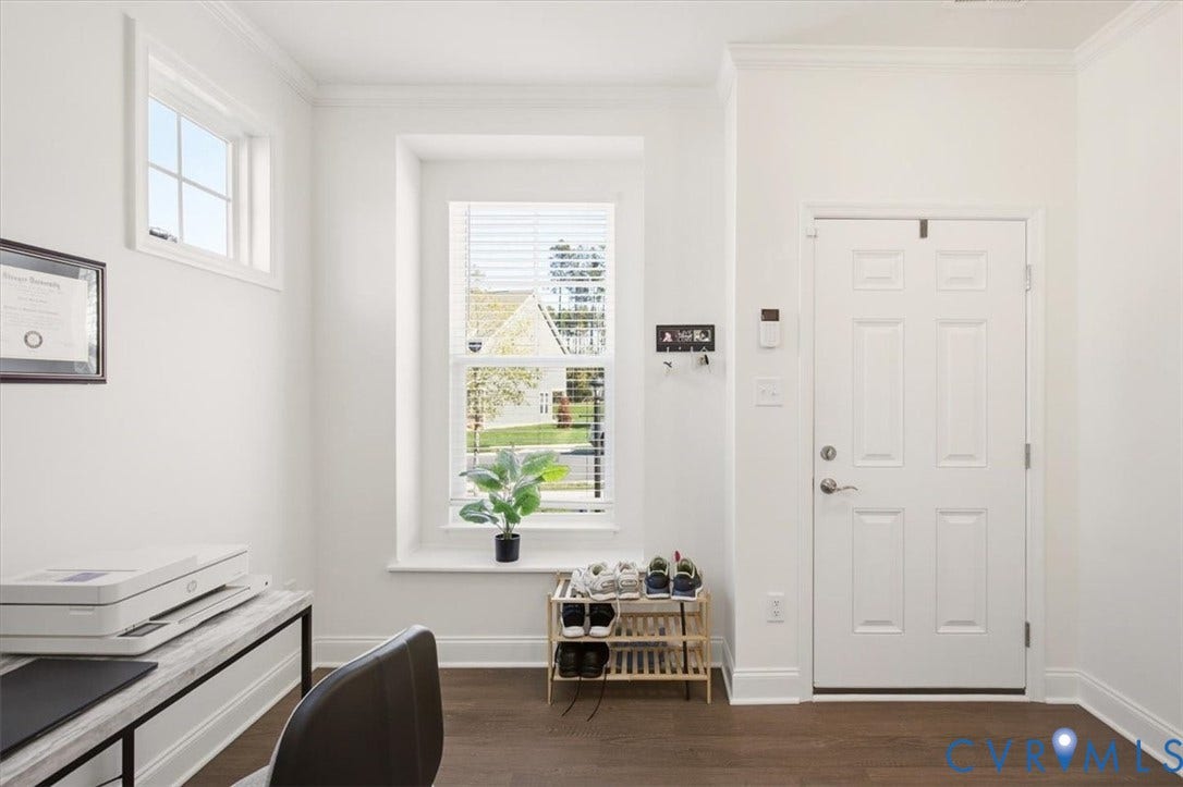 18743 Palisades Ridge, Palisades Cove, Moseley, VA 23120 Entry featuring wood-finish flooring, a six-panel door, crown molding, and two windows with a deep sill