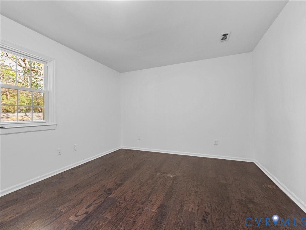 5504 Chanson Road, Salem Woods, North Chesterfield, VA 23237 Neutral-toned interior room featuring wood-finish flooring and a multi-pane window with a white frame