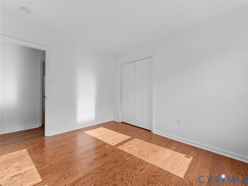 5504 Chanson Road, Salem Woods, North Chesterfield, VA 23237 Neutral interior with wood-finish flooring and double-panel closet doors