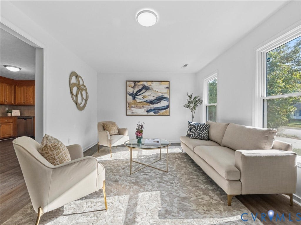 5504 Chanson Road, Salem Woods, North Chesterfield, VA 23237 Living area featuring wood-finish flooring, neutral walls, large windows, and a ceiling-mounted light fixture