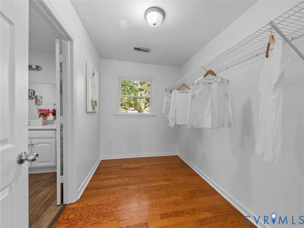 5504 Chanson Road, Salem Woods, North Chesterfield, VA 23237 Walk-in closet featuring wood-finish flooring, a white-framed window, and wire shelving