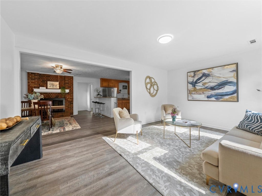 5504 Chanson Road, Salem Woods, North Chesterfield, VA 23237 Living area featuring wood-finish flooring and a floor-to-ceiling brick fireplace with a custom mantle
