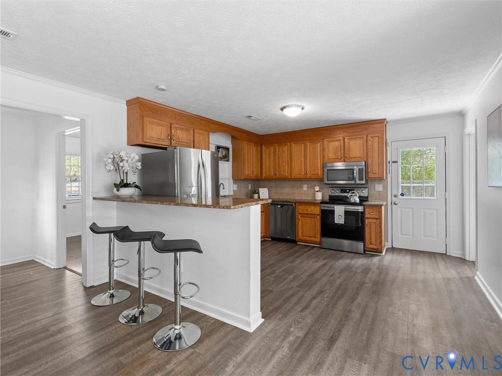 5504 Chanson Road, Salem Woods, North Chesterfield, VA 23237 Kitchen featuring wood cabinetry, stone-finish countertops, stainless steel appliances, and wood-finish flooring