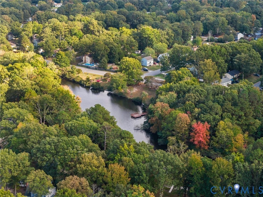 5504 Chanson Road, Salem Woods, North Chesterfield, VA 23237 Aerial perspective featuring a body of water, wooded landscape, and a wooden dock