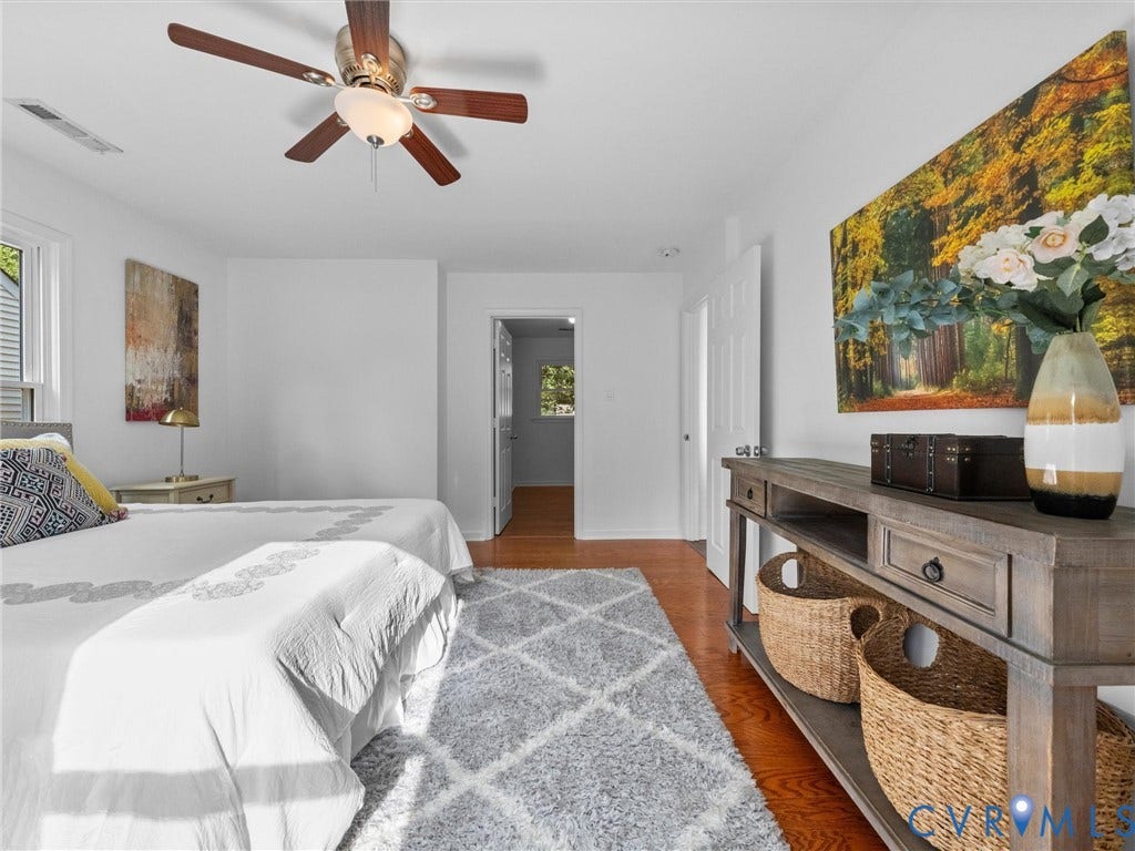 5504 Chanson Road, Salem Woods, North Chesterfield, VA 23237 Wood-finish flooring, central ceiling fan with integrated lighting, and white six-panel interior doors