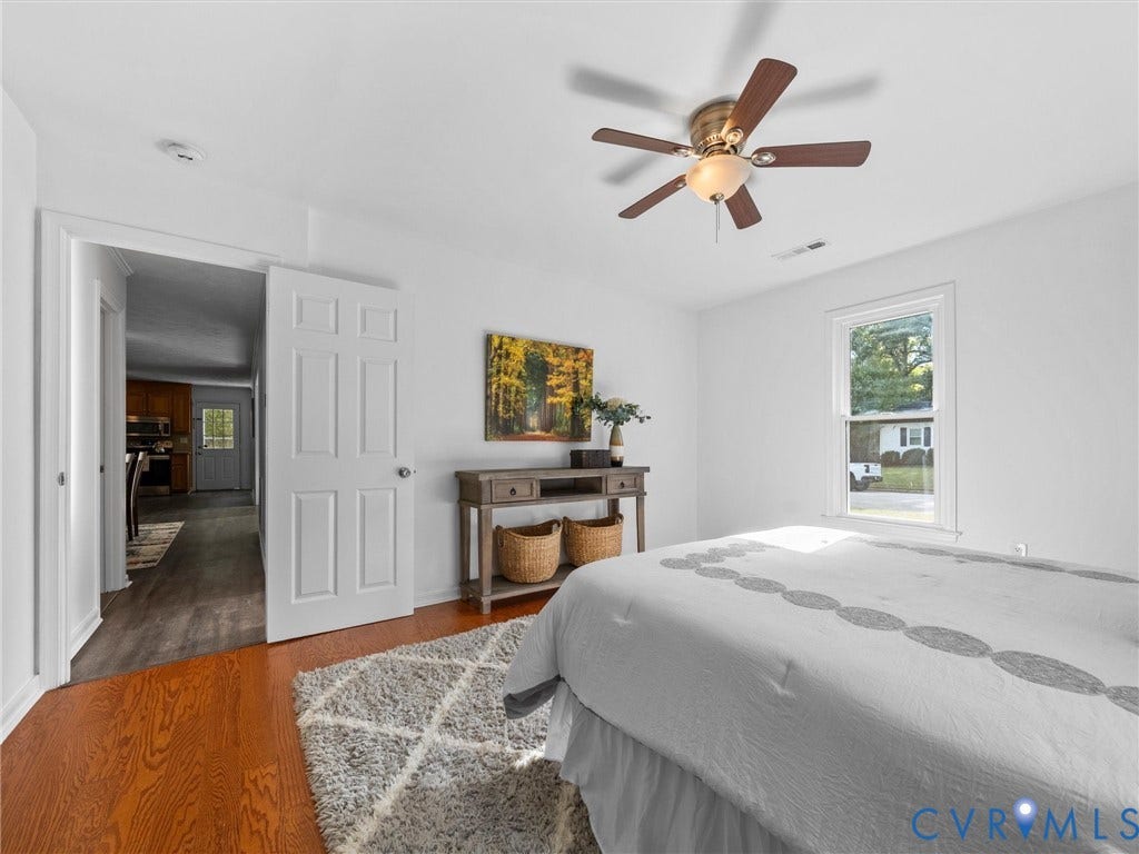 5504 Chanson Road, Salem Woods, North Chesterfield, VA 23237 Interior space featuring hardwood flooring, multi-pane window, and ceiling-mounted light fixture with fan