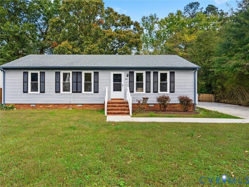 5504 Chanson Road, Salem Woods, North Chesterfield, VA 23237 Single-story residence featuring light-toned horizontal siding, a brick foundation, dark window shutters, and a concrete front walkway