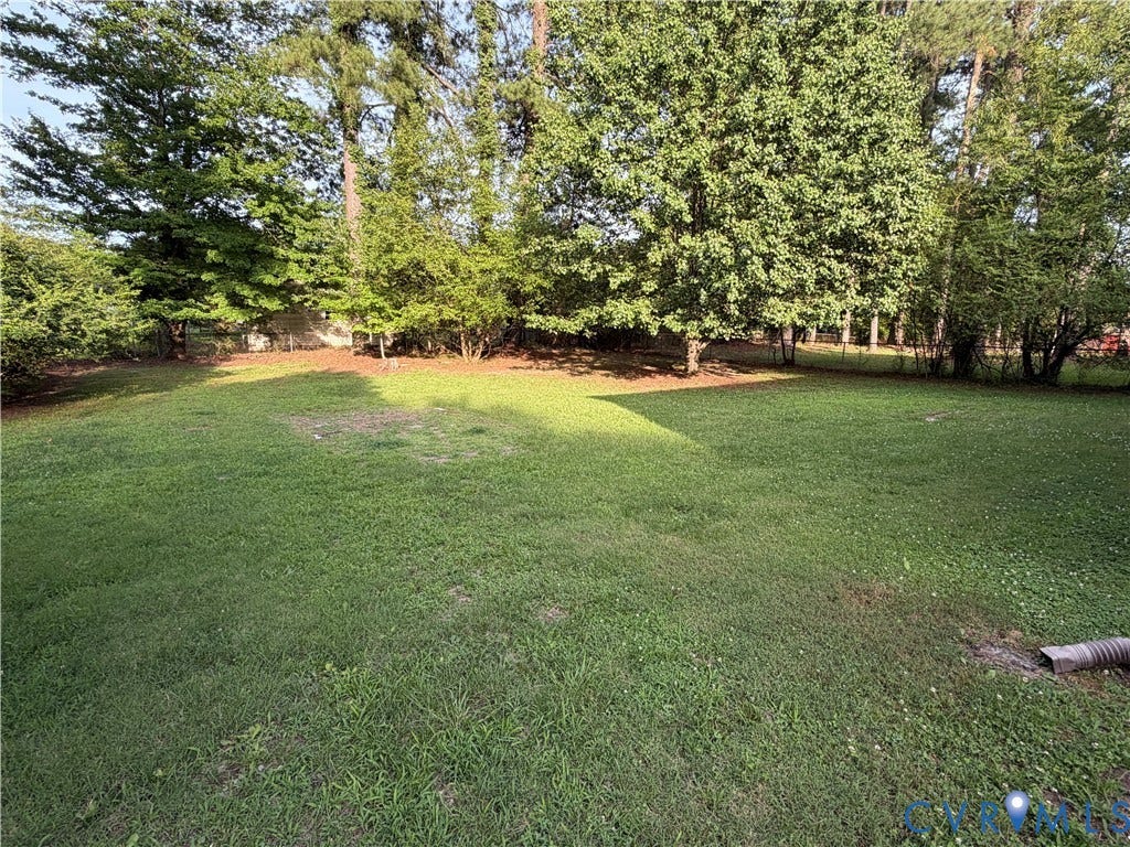 1513 West Lane, Petersburg, VA 23803 Expansive backyard featuring a level lawn and mature perimeter trees