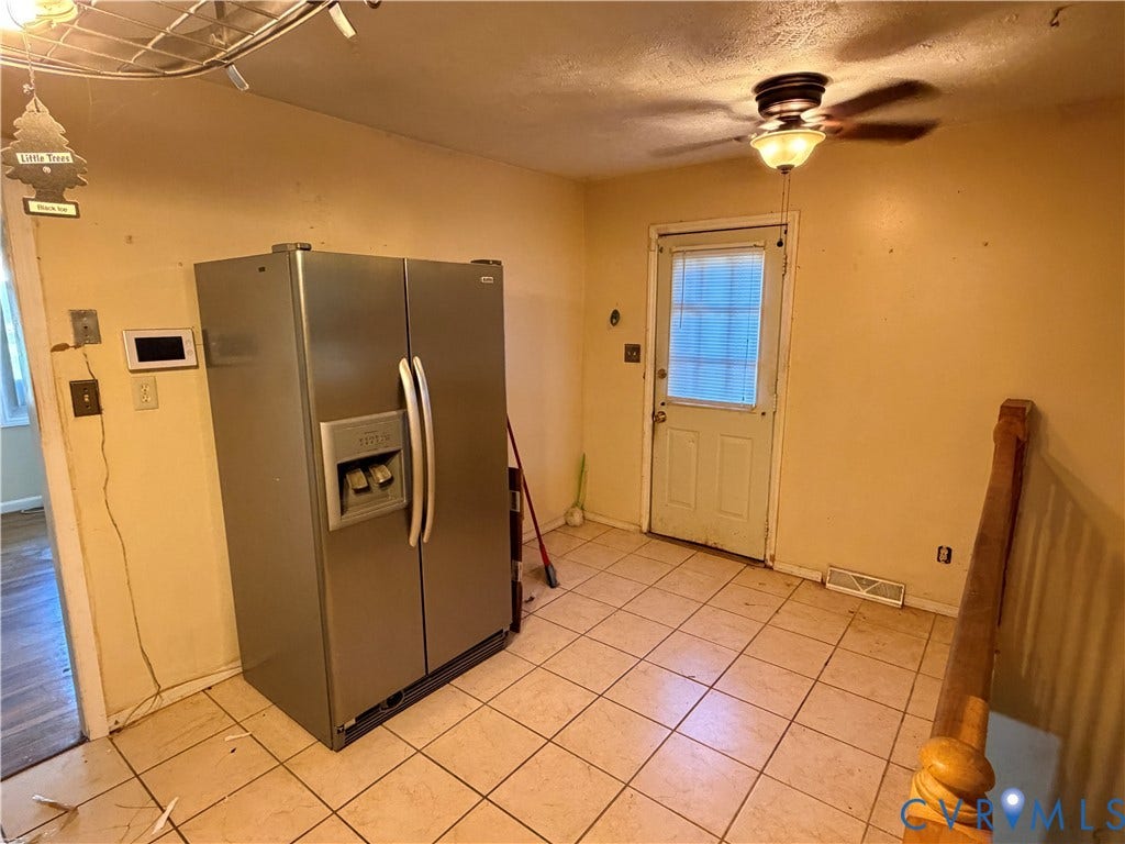 1513 West Lane, Petersburg, VA 23803 Stainless steel side-by-side refrigerator, ceramic tile flooring, and ceiling-mounted light fixture with integrated fan