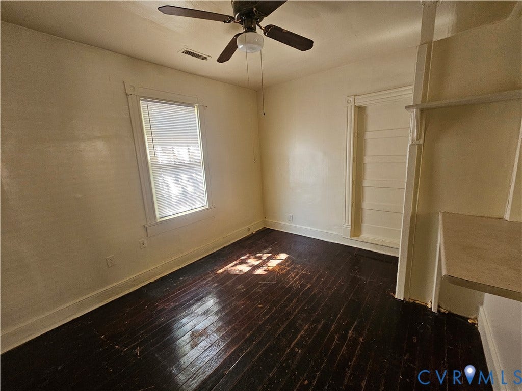 3503 Lawson Street, Richmond, VA 23224 Wood-finish flooring, ceiling fan with integrated lighting, single-hung window with casing, and built-in shelving unit