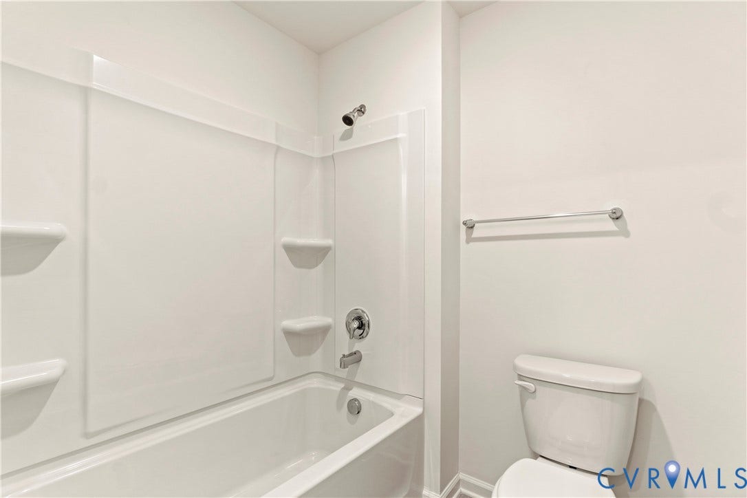 11231 Chappell Creek Circle, Chappell Creek, North Prince George, VA 23860 White tub and shower combination with integral shelving and chrome fixtures