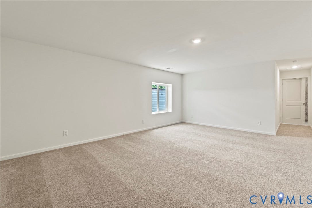 11231 Chappell Creek Circle, Chappell Creek, North Prince George, VA 23860 Spacious room featuring neutral carpet flooring, white painted walls, a window with a window well, and recessed lighting
