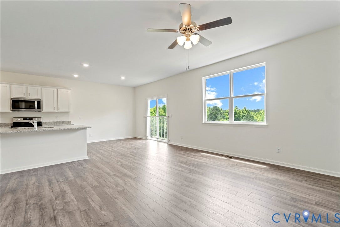 11231 Chappell Creek Circle, Chappell Creek, North Prince George, VA 23860 Open-concept living area featuring wood-finish flooring, recessed lighting, and a ceiling fan
