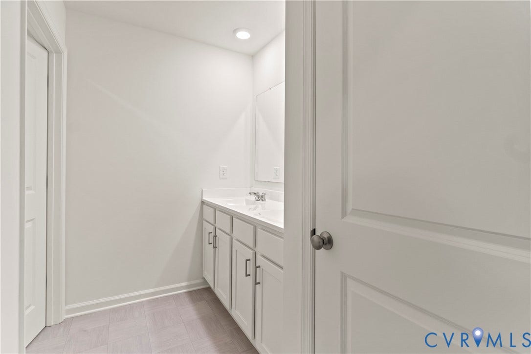 11231 Chappell Creek Circle, Chappell Creek, North Prince George, VA 23860 Bathroom vanity with dual sinks, a white countertop, and light gray cabinetry