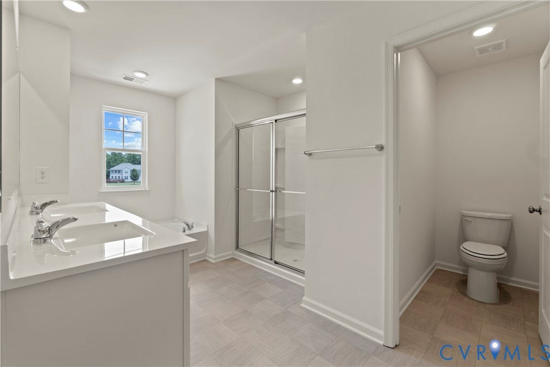 11231 Chappell Creek Circle, Chappell Creek, North Prince George, VA 23860 Bathroom featuring a dual vanity with undermount sinks, a quartz-look countertop, and chrome fixtures