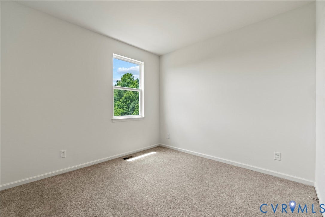 11231 Chappell Creek Circle, Chappell Creek, North Prince George, VA 23860 Bright interior room featuring a window with natural light, light neutral wall paint, and plush carpeting