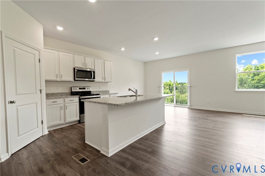 11231 Chappell Creek Circle, Chappell Creek, North Prince George, VA 23860 Open-concept living space featuring wood-finish flooring throughout