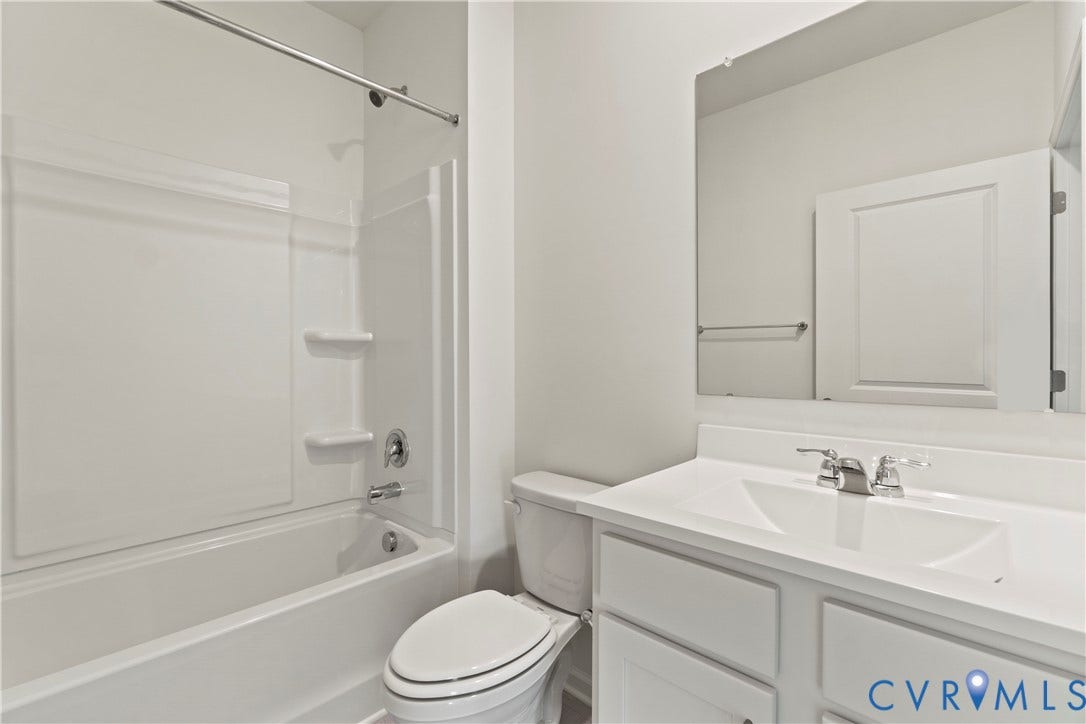11231 Chappell Creek Circle, Chappell Creek, North Prince George, VA 23860 Bathroom featuring a shower/tub combination, single vanity with integrated sink, chrome fixtures, and a frameless mirror