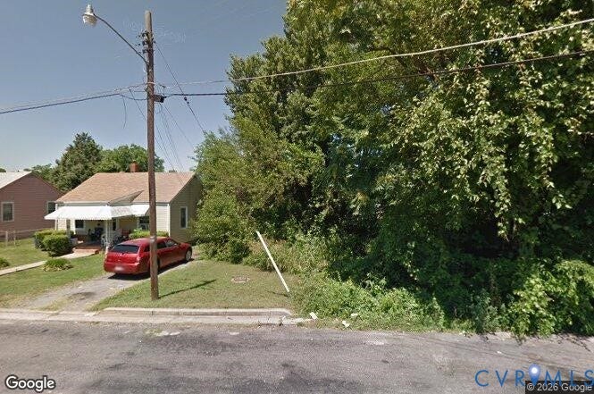 804 Rosemont Street, Petersburg, VA 23803 Single-story exterior with a gabled roof, light-toned siding, and a covered front porch featuring a metal awning