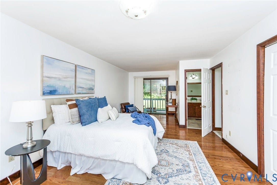 4124 Cogbill Road, Ampthill, VA 23234 Wood-finish flooring, sliding glass door with exterior access, flush-mount ceiling lighting, and six-panel interior doors