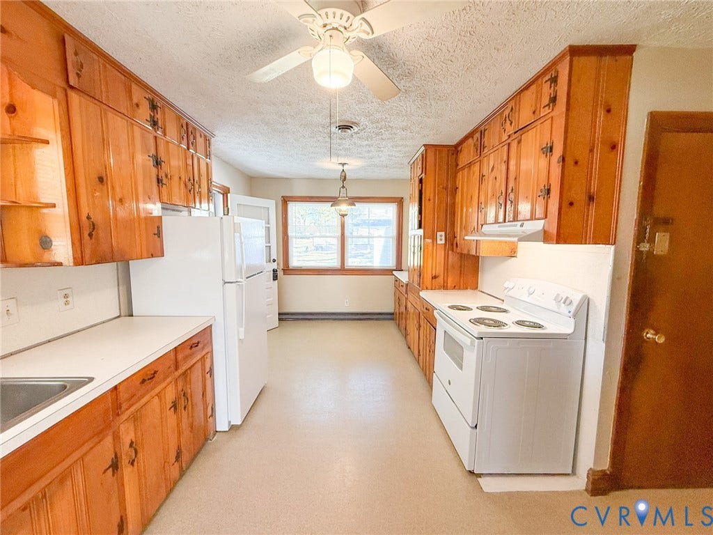 109 Rock Castle Avenue, Crewe, VA 23930 Kitchen featuring natural wood cabinetry, white countertops, built-in range, ceiling fan, and windowed exterior door